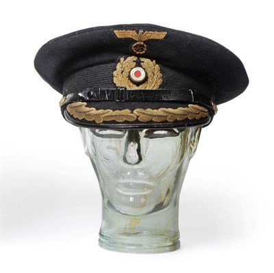 Lot 102 - A German Third Reich Kriegsmarine Officer's Peaked Cap, in dark navy/black wool with mohair...