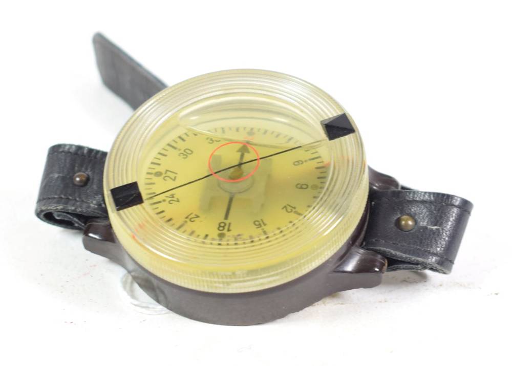 Lot 105 - A Third Reich Luftwaffe Pilot's Wrist Compass, model AK 39, further stamped, ''Fl 23235-1'' and...
