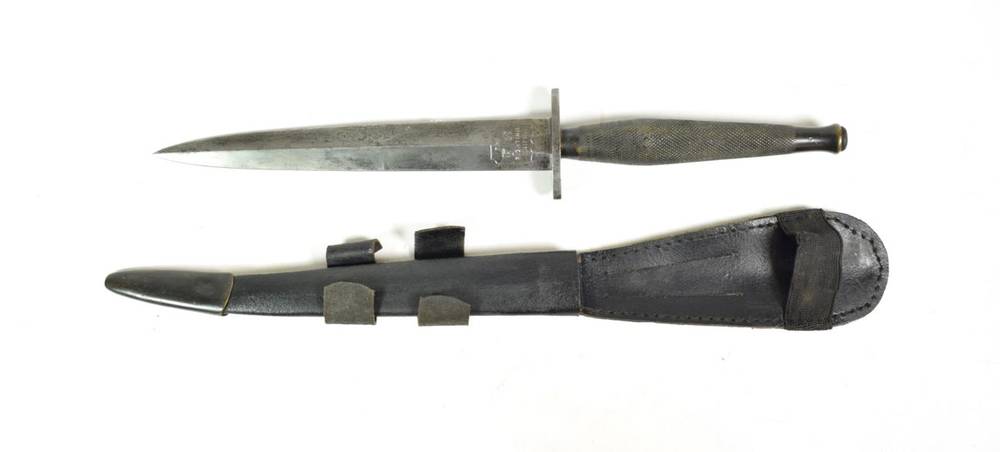 Lot 141 - A Fairbairn Sykes F.S. Fighting Knife, second pattern, the 17.5cm double edge hand forged steel...