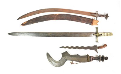 Lot 162 - A Ngombe Executioner's Sword, Congo, the 41cm fancy sickle shape steel blade decorated with incised
