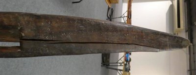 Lot 170 - A Late 19th/Early 20th Century Aborigine Wood Parrying Shield, of rounded elongated elliptical...