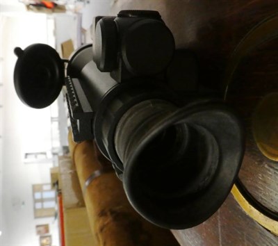 Lot 194 - A Yukon Optics Night Vision Riflescope, with manual and fitting bar, original box, together...