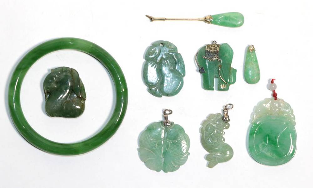 Lot 2 - Six jade pendants of varying sizes (a.f.); a jade collar stud (a.f.) and a jade bangle, inner...