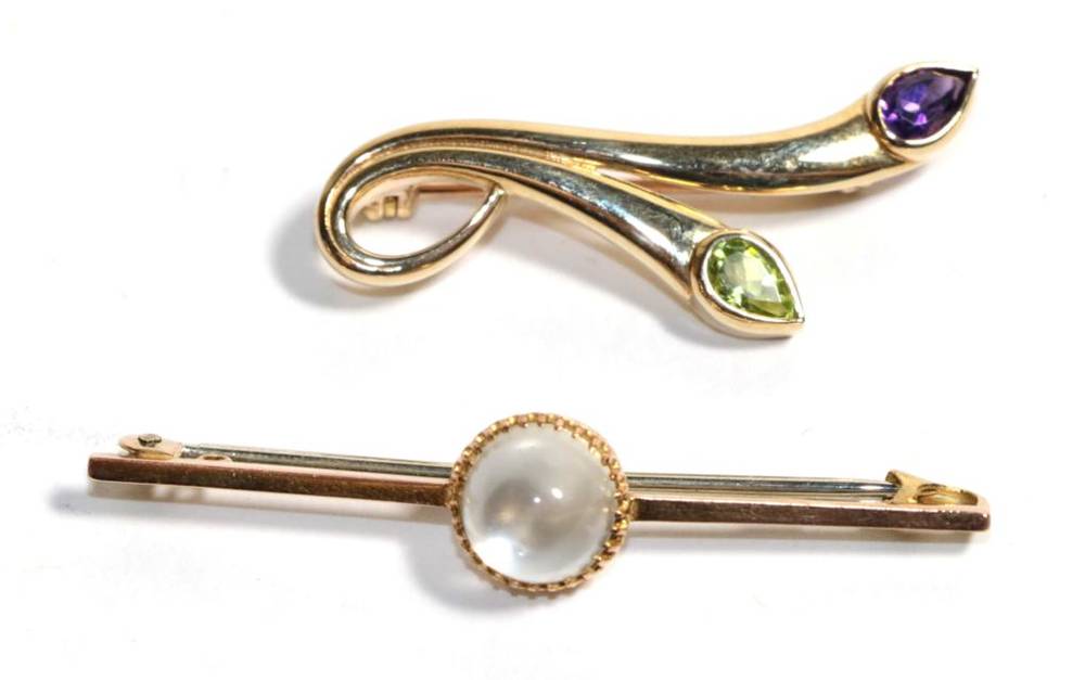 Lot 8 - A moonstone brooch, stamped '9ct', length 5cm; a 9 carat gold amethyst and peridot brooch,...