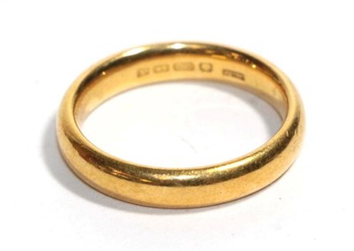 Lot 11 - A 22 carat gold band ring, finger size O