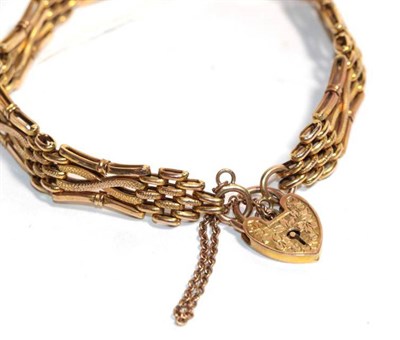 Lot 15 - A gate link bracelet with heart shaped padlock clasp, both stamped '9ct', length 19.5cm