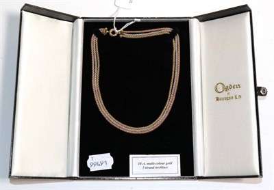 Lot 16 - An 18 carat three colour gold rope necklace, length 41cm, in an Ogdens of Harrogate box