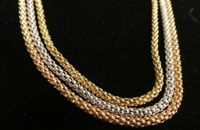 Lot 16 - An 18 carat three colour gold rope necklace, length 41cm, in an Ogdens of Harrogate box