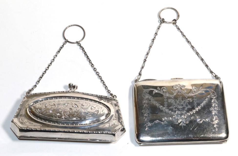 Lot 32 - Two silver purses, Birmingham 1912 and 1918, both with decorative engraving, one also with...