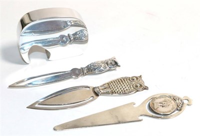 Lot 36 - A Georg Jenson bottle opener, two owl book marks and another (4)