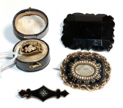 Lot 47 - A collection of Victorian mourning jewellery, comprising of an 18 carat gold ring, finger size M; a