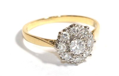 Lot 49 - A diamond cluster ring, stamped '18CT & PLAT', finger size M