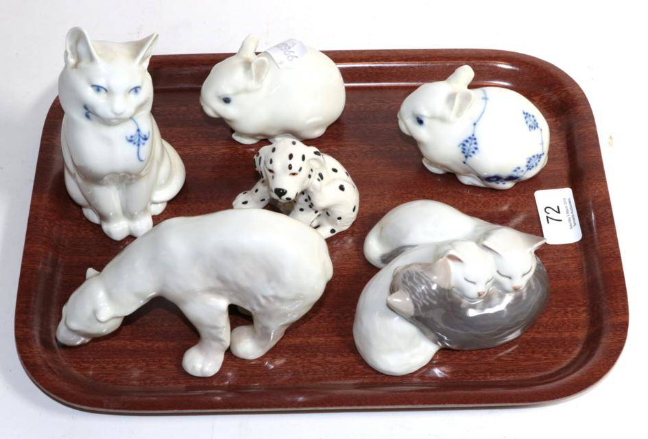 Lot 72 - Six Royal Copenhagen porcelain animal ornaments comprising two cats; two rabbits; polar bear...