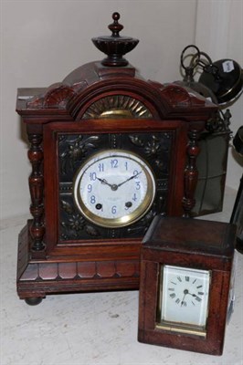 Lot 119 - A walnut cased striking mantle clock with floral embossed front and side panels retailed by...
