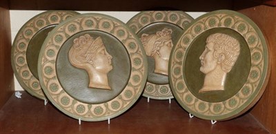 Lot 120 - A set of four Neo Classical painted plaster roundels, circa 1900, depicting Roman profiles with...