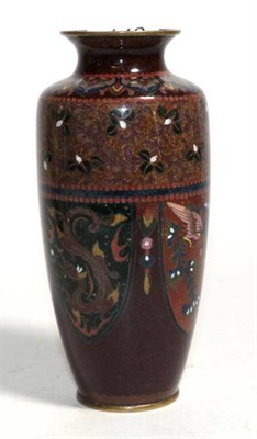 Lot 142 - A cloisonne baluster vase with shield shaped panels containing dragons on a light brown background