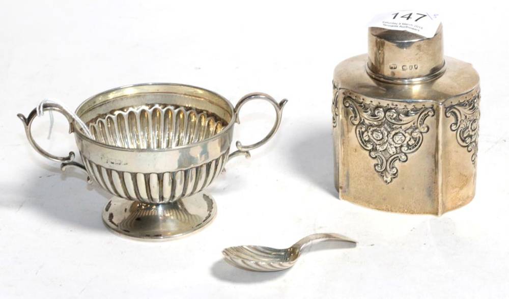 Lot 147 - A silver tea caddy, Sibray, Hall & Co., London 1894, a silver twin handled pedestal cup with...