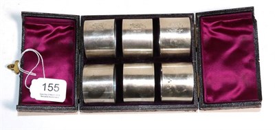 Lot 155 - A cased set of six silver napkin rings, Walter & John Barnard, London 1890, each engraved with...