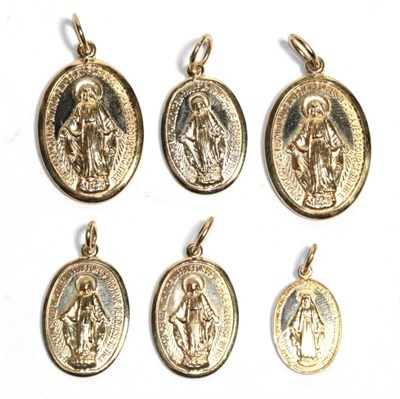 Lot 192 - Six 9 carat gold 'Our Lady' charms/pendants, of varying sizes
