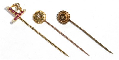 Lot 194 - Three stick pins, two stamped '15CT', the other '18' (3)
