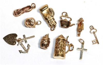 Lot 196 - Ten charms including a cross, a shell, a boxing glove etc (10)