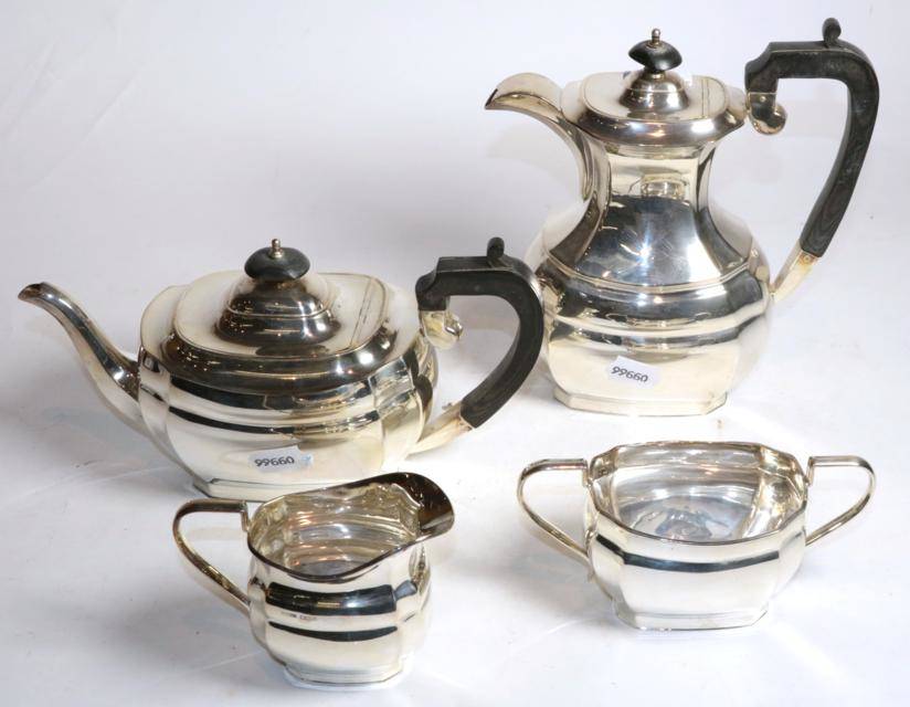 Lot 221 - A four piece silver tea service, Harrison Fisher & Co, Sheffield 1975, the hot water jug 23cm high