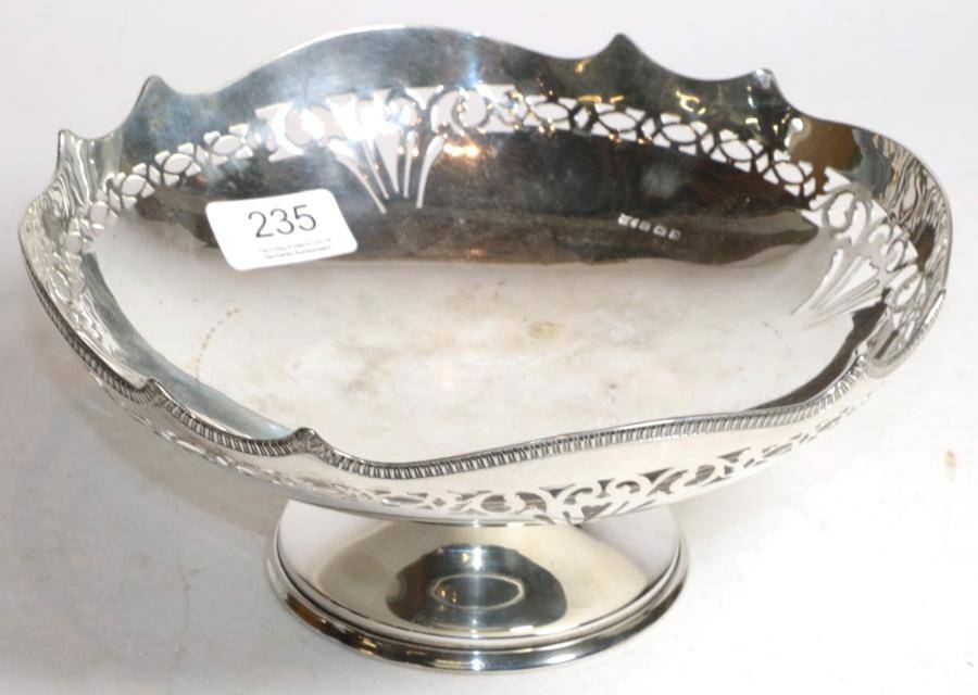 Lot 235 - A silver pedestal bowl, Mappin & Webb, Birmingham 1927, with shaped and pierced rim, 22cm diameter