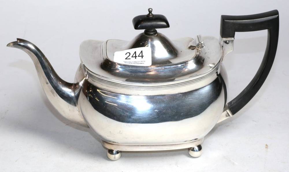 Lot 244 - A silver teapot of George III style, Z Barraclough & Sons, Chester 1921, rounded rectangular on...