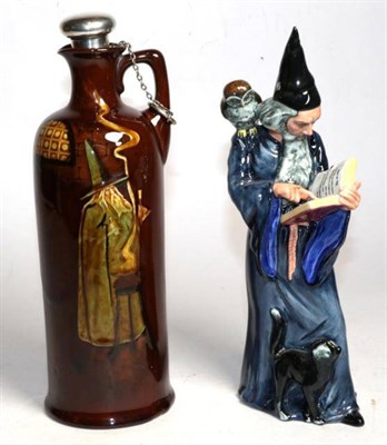 Lot 245 - A Royal Doulton figure 'The Wizard' HN2877 and a Royal Doulton Kingsware wizard jug, designed...