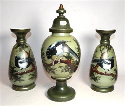 Lot 256 - A Victorian painted opaque glass garniture decorated with magpies