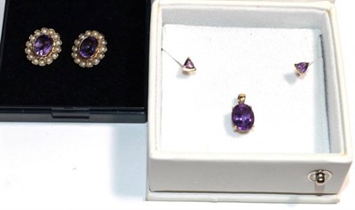 Lot 271 - A pair of 9 carat gold amethyst and seed pearl earrings, measure 1.25cm by 1.5cm, with post...