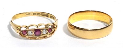 Lot 291 - An 18 carat gold diamond and ruby five stone ring, finger size S; and a 22 carat gold band...