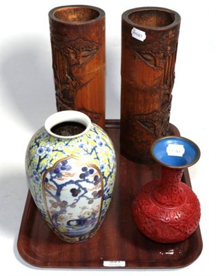 Lot 331 - A pair of carved bamboo spill vases; a Japanese porcelain baluster vase; and a cinnabar lacquer...