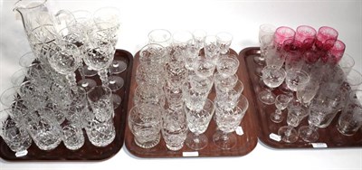 Lot 334 - A quantity of assorted crystal, engraved glasses, ruby tinted glass etc (three trays)