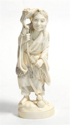 Lot 336 - A Japanese ivory okimono of a sennin with toad, circa 1910