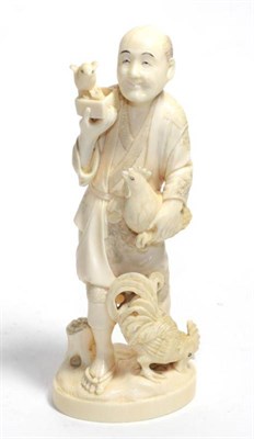 Lot 337 - A Japanese ivory okimono of a peasant and three fowl, circa 1910