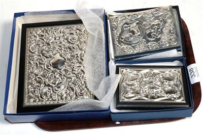 Lot 338 - A modern silver fronted bible; address book; and five year diary, as new (3)