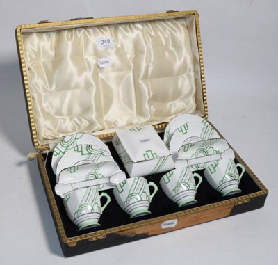 Lot 348 - A Tuscan cased Art Deco coffee and smoking set, comprising four coffee cups and saucers, a pair...