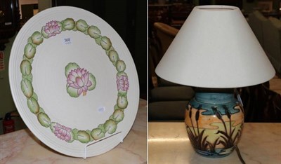 Lot 368 - A modern Moorcroft pottery lamp and a Charlotte Rhead charger (2)