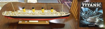 Lot 1016 - A model of the Titanic, with magazines