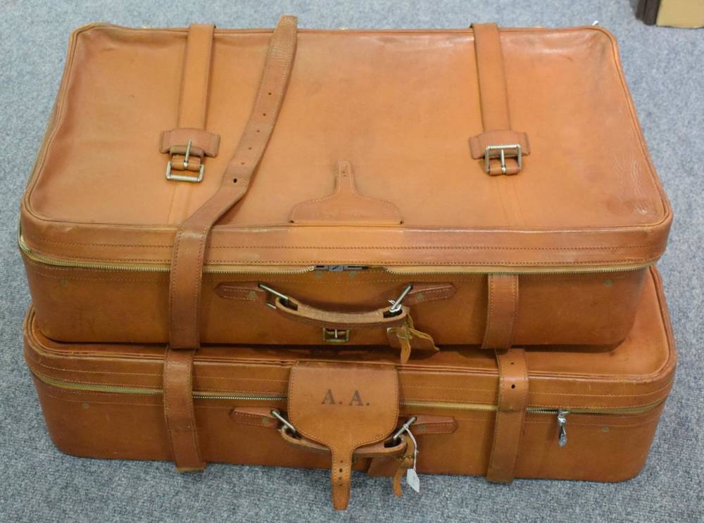 Lot 1034 - Pair of Harrods tan leather suitcases, each embossed with initials A.A, the interior with...