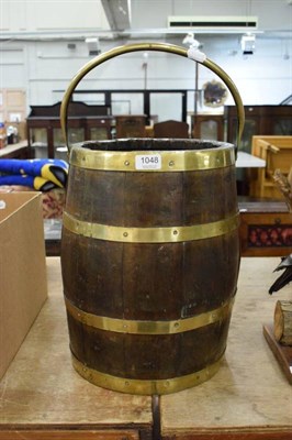 Lot 1048 - Coopered barrel with spring handle