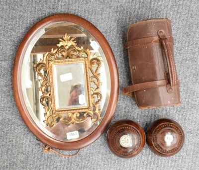 Lot 1063 - Taylor Rolph & Co, two Lignum bowls in case, gilt metal mirror and an oval bevel glass mirror