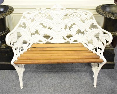 Lot 1081 - A painted cast garden bench, in the Coalbrookdale style