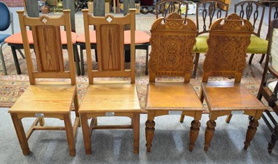 Lot 1175 - A pair of carved oak hall chairs, together with a pair of ecclesiastical pitch pine chairs, all...