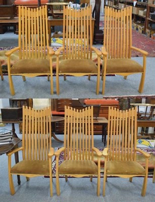 Lot 1179 - A set of six golden oak slatted back open armchairs