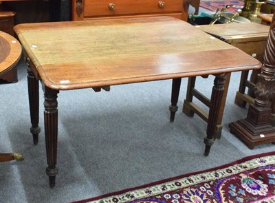 Lot 1183 - An early 19th century mahogany Pembroke table on reeded legs