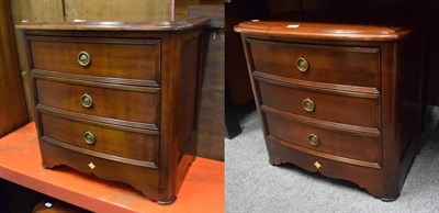 Lot 1189 - A pair of reproduction three height chest of drawers