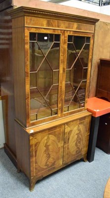 Lot 1190 - A reproduction mahogany glazed bookcase