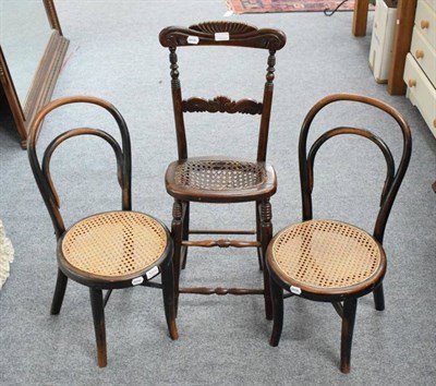 Lot 1202 - A pair of cane seated childs chairs and another similar